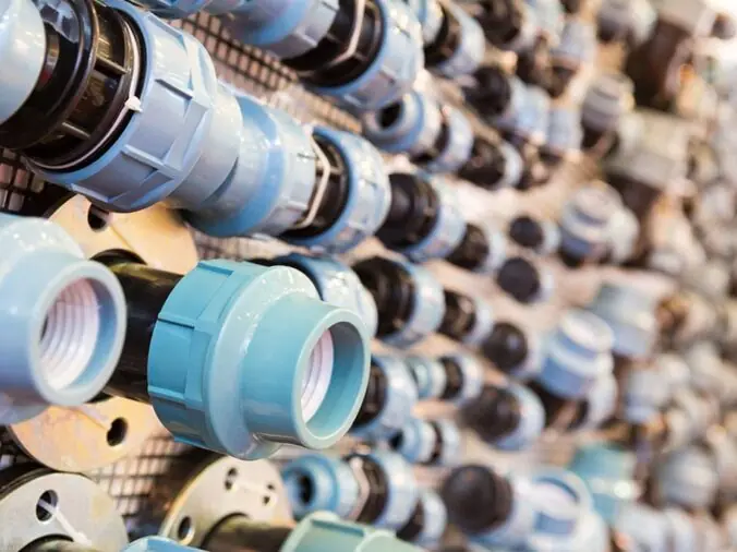 PVC plumbing fittings and unions in a plumbing supply store